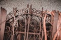Shod fence. Old rusty forged fence, scrap metal