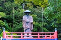 Shodoshima, Japan - September 25, 2023: Statue of wandering pilgrim in traditional robes and hat at outdoor temple