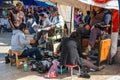 Shoe cleaners hard working in hot weather in Tlacolula village, Oaxaca region of Mexico