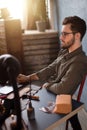 Shoe designer having a rest while sitting at workplace Royalty Free Stock Photo