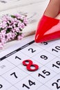 Shoe, flowers and calendar.