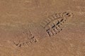Shoe footprint on wet sand texture Royalty Free Stock Photo