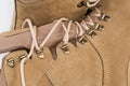 Shoe lacing of beige leather combat boots, fragment close-up Royalty Free Stock Photo