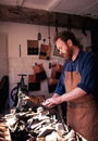 Shoe maker in workshop. Royalty Free Stock Photo