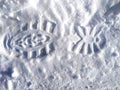 Shoe marks in the snow. A clear imprint of the pattern of the sole of the boots on a snowy field