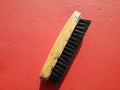 Shoe polish brush photo on red background Royalty Free Stock Photo