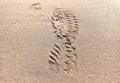 shoe prints in the sand on the beach Royalty Free Stock Photo