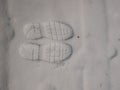 Shoe prints in the white snow