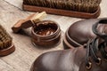 Shoe shine. Brushes for cleaning and polishing shoes. Cream brush and boots Royalty Free Stock Photo