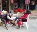 Shoe shiner at work Royalty Free Stock Photo