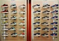 Shoe shop. Shelves with many sneakers.