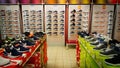 Shoe shop. Shelves with many sneakers. Royalty Free Stock Photo