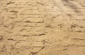 Shoe sole print on wet sand, sunny day in nature, shape and texture Royalty Free Stock Photo