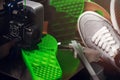 Shoe sole prototype with inner structure pattern is printed from green plastic filament in mysterious scene. Royalty Free Stock Photo