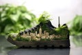 A shoe that strives to minimize its carbon impact, integrating vegetation and supporting city-wide recycling to create a healthier