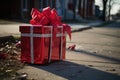 a shoebox-sized gift with shiny ribbons in a red mailbox