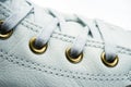 shoelaces tied on sneakers with metal eyelets