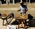A shoemaker or cobbler showing how makes shoes and espadrille soles made with hemp and esparto grass