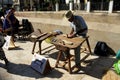 A shoemaker or cobbler showing how makes shoes and espadrille soles made with hemp and esparto grass