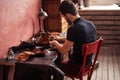 Shoemaker fullfilling an order.craftsman executes an order Royalty Free Stock Photo