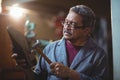Shoemaker hammering on a shoe Royalty Free Stock Photo
