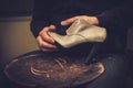 Shoemaker performs shoes in studio craft.