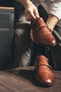 The shoemaker puts new shoes on the table Royalty Free Stock Photo