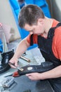 Shoemaker repair shoe. Glueing the sole for male footwear