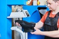 Shoemaker repair shoe. Pressing the sole for male footwear