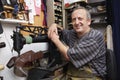 Shoemaker Repairing Boot in Shoe Shop