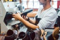 Shoemaker roughing the sole of a leather shoe Royalty Free Stock Photo