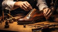 Shoemakers hands assembling fashionable mens leather shoes