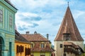 Shoemakers guild tower and colorful romanian houses, Sighisoara, Transylvania Royalty Free Stock Photo