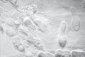 Shoeprints in snow. walking in the snow. footprints in the snow. Light gray and white background.