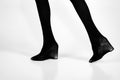 Shoes and black tights on slim legs of girl Royalty Free Stock Photo