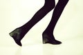 Shoes and black tights on slim legs of girl Royalty Free Stock Photo