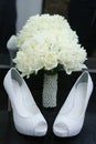 Shoes bouquet of white roses pearls support Royalty Free Stock Photo
