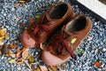 Shoes boy scout brown on ground gravel Royalty Free Stock Photo