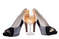 Shoes and champagne isolated Royalty Free Stock Photo
