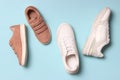 shoes for children and women's sneakers on a colored background top view. Royalty Free Stock Photo