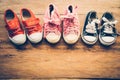 Shoes for children on wooden floor - lifestyle Royalty Free Stock Photo