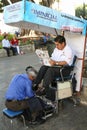 Shoes cleaning service on a street in Oaxaca