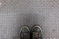 Shoes on diamond iron plate Royalty Free Stock Photo