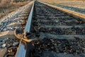 Shoes dirty and old lying on rails, railway accident, sunset in autumn