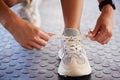 Shoes, fitness and woman getting ready for training, exercise or running in sports sneakers, fashion and motivation