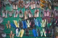 Shoes on metal frame hanging in the air.