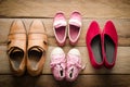 Shoes, four pairs of dad, mom, daughter and son - the family concept.