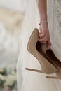 Shoes in hand bride background wedding lace dress