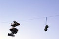 Shoes hanging on a cable Royalty Free Stock Photo