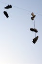 Shoes hanging on a cable